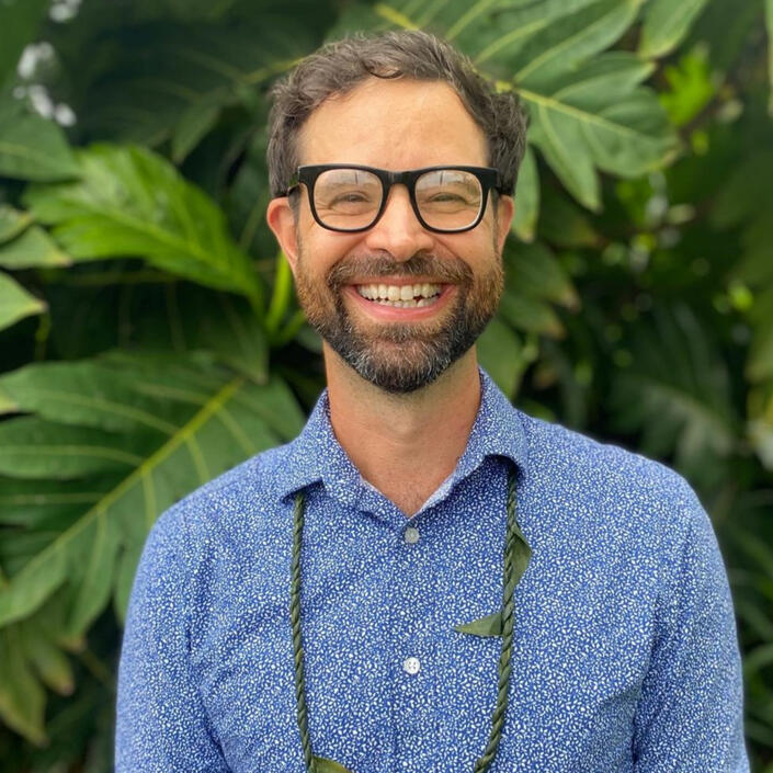 Adrian Standing in front of ulu tree
